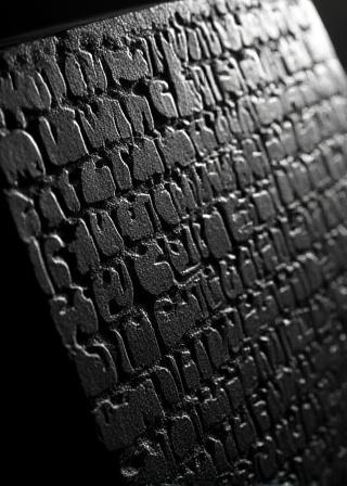 Calligraphy engraved into dark polished stone